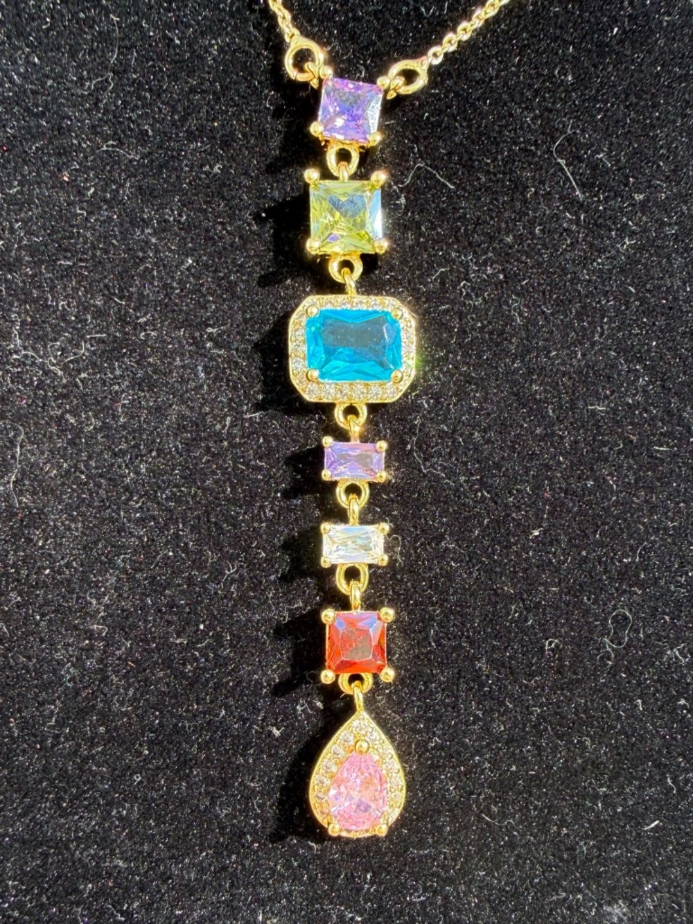 Multicolored gemstone necklace cascading down with sparkly colors - Picture 3 of 7